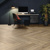 Herringbone Sable Apres Oak floors contrast with the moody office aesthetic