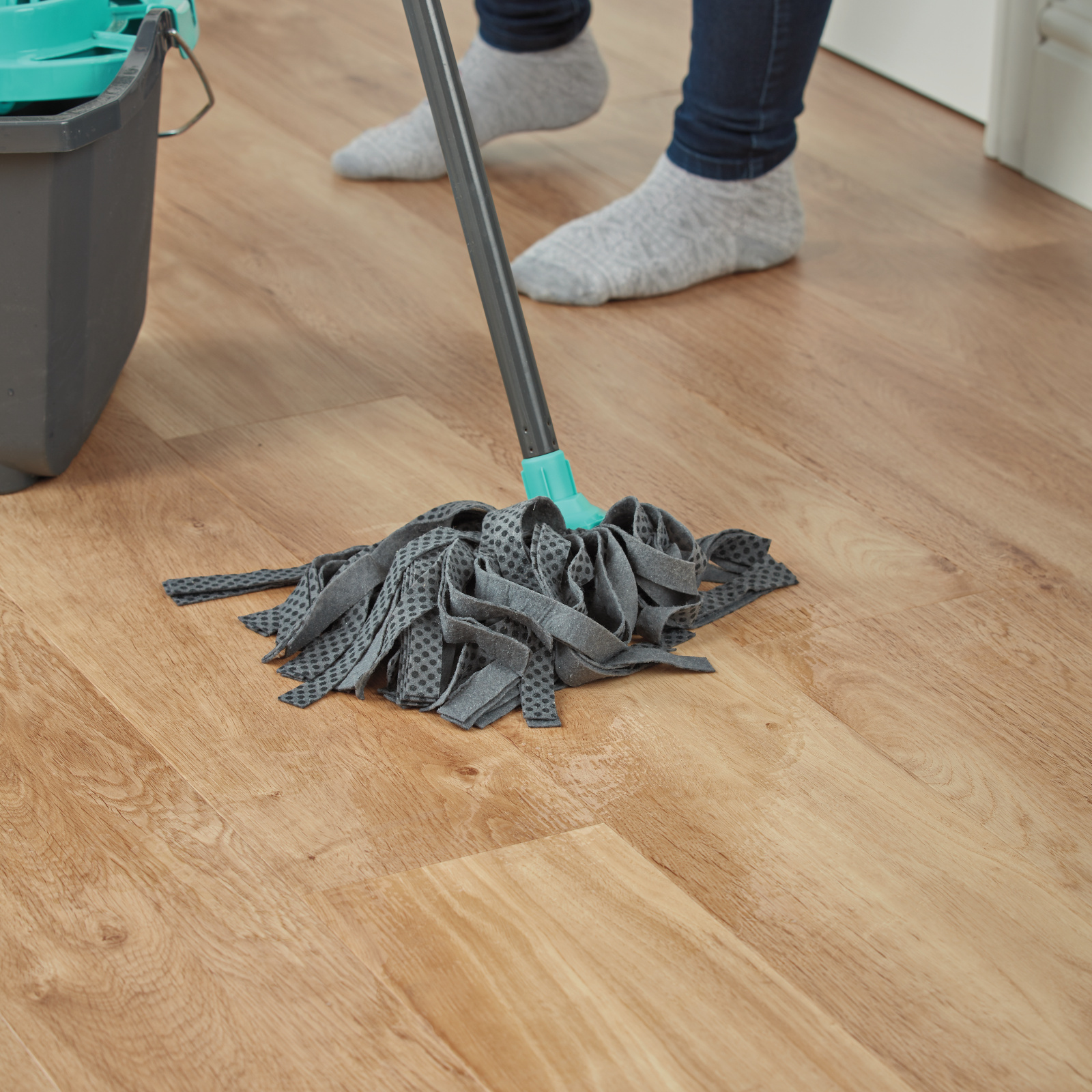 Person mopping French Oak VGW85T | SCB85 floors