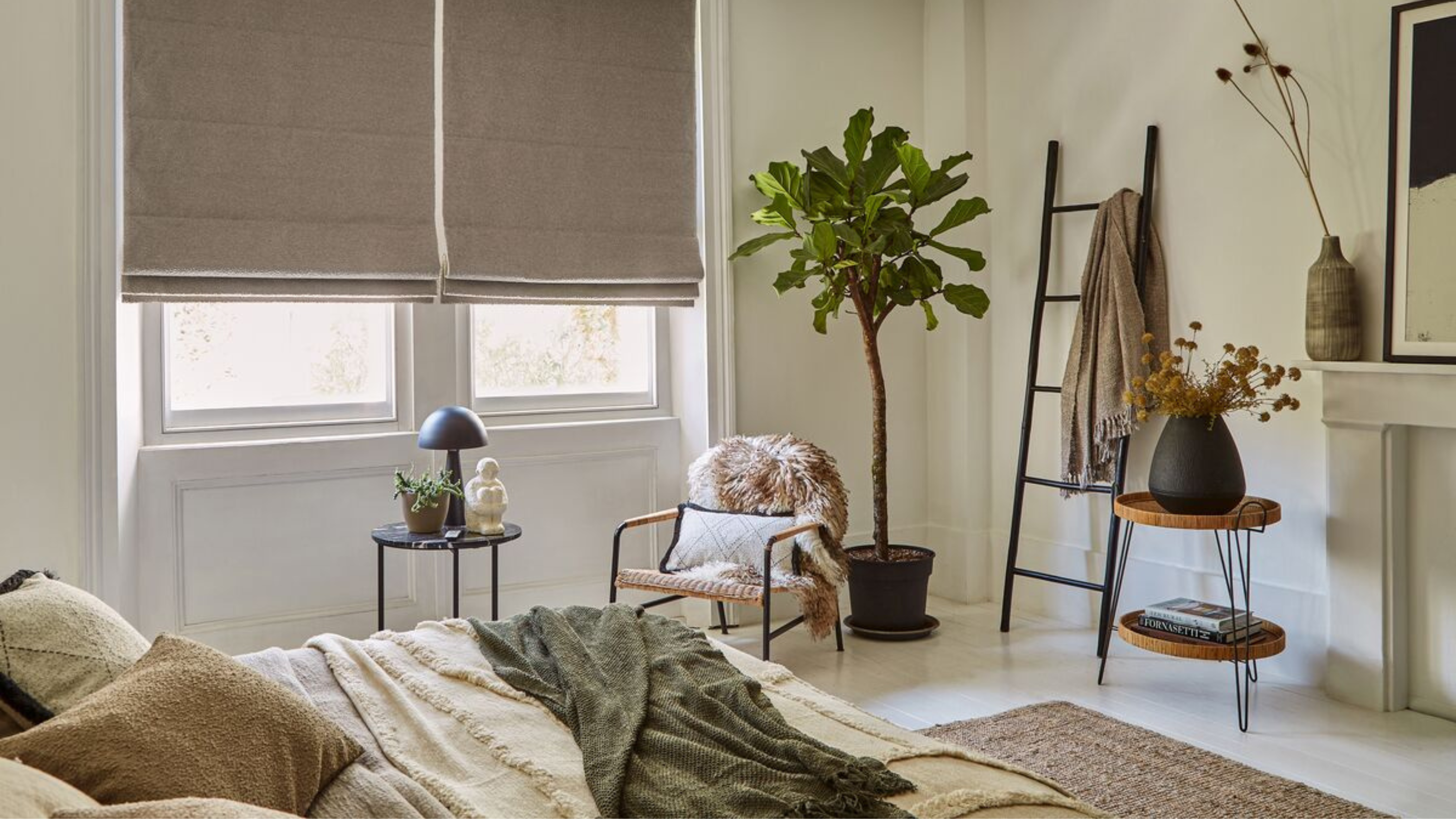 Scandi style bedroom with mild cream, white and green colours and Hillarys curtains.