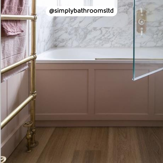 Pink bath tub surrounded by Warm Brushed Oak RKP8215 floors; photo credit: @simplybathroomsltd