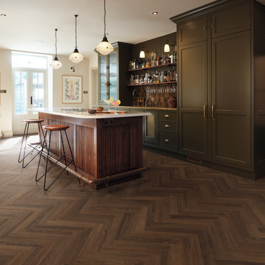 Nutmeg limed oak herringbone dark brown lvt flooring in a kitchen